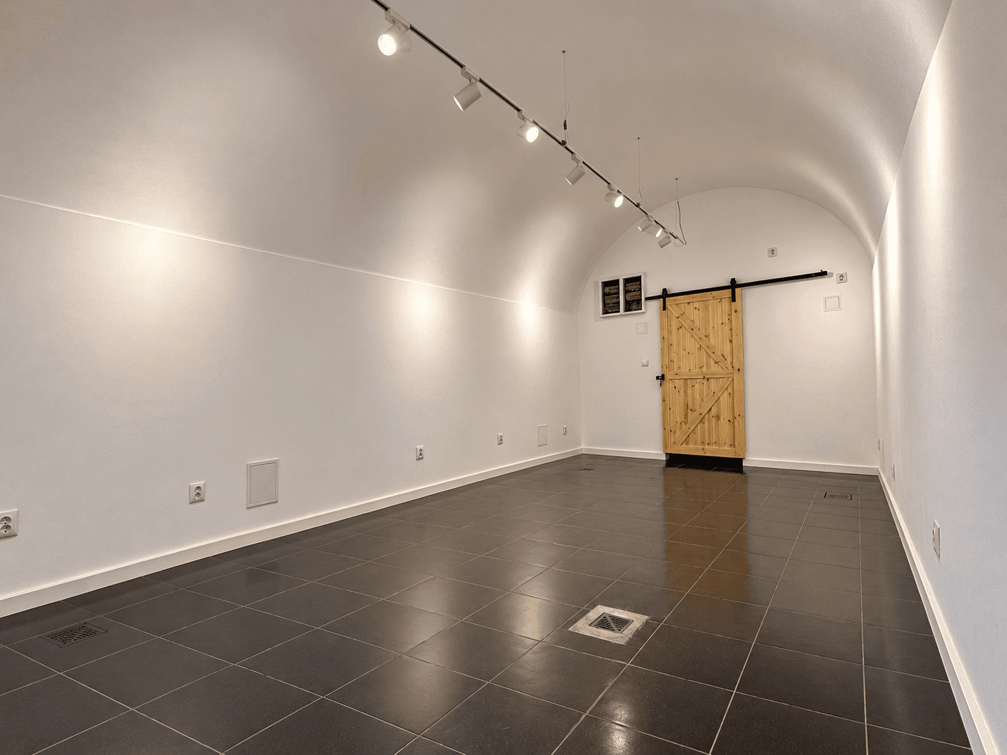 Room 1, to the right of the staircase